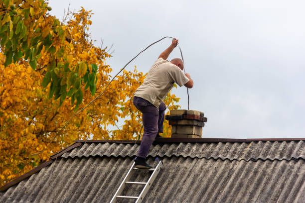 Line dropped down a flue under autumn leaves